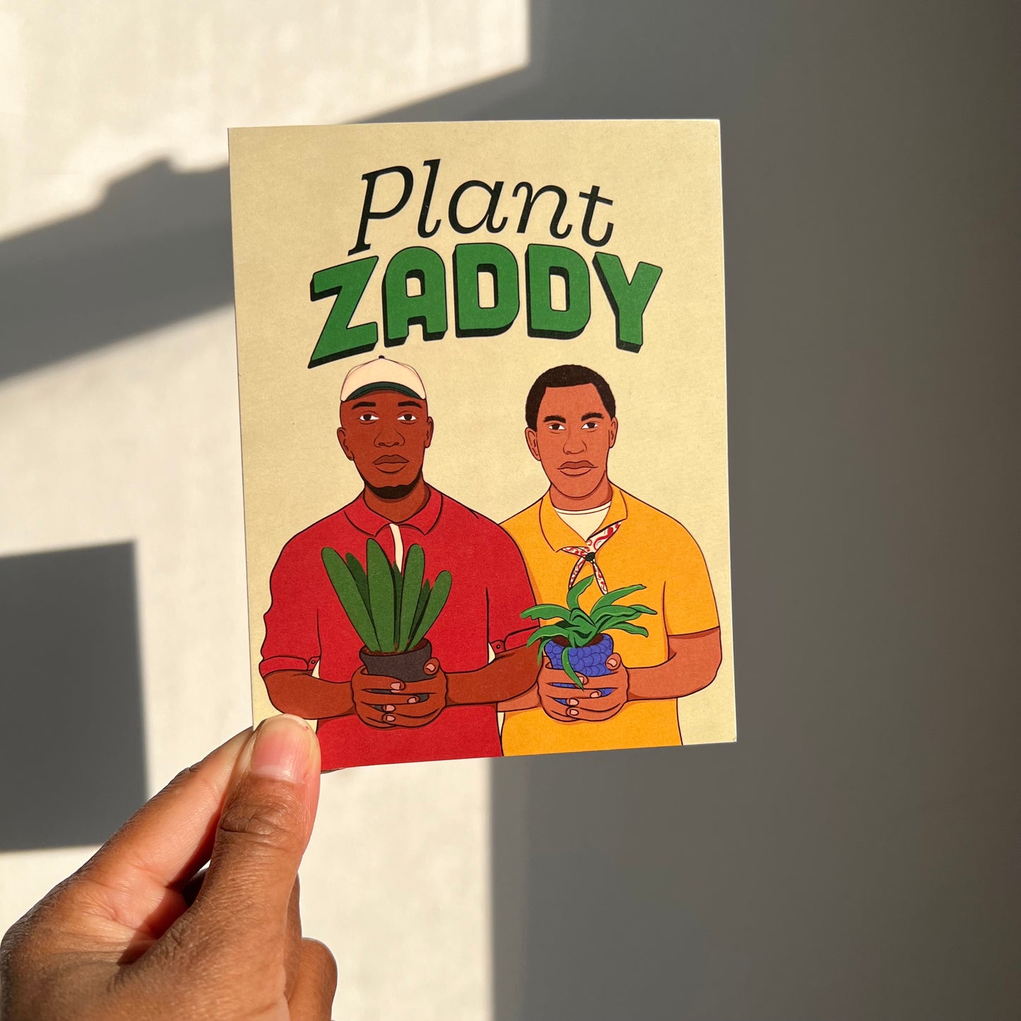 4.25 x 5.5” A2 eco-friendly greeting card featuring two stylish African American men holding plants with the playful phrase "Plant Zaddy" at the top. Perfect for celebrating plant enthusiasts. Envelope included. Black Woman Owned.