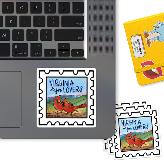 Vibrant postage stamp sticker with an illustration of two northern cardinal birds and the Shenandoah Valley silhouette in the background. Includes the words ‘Virginia Is For Lovers’. Ideal for laptops, water bottles, and more!