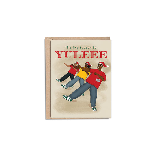 A2 card illustration of 3 guys dancing to Soulja Boy's song Crank Dat Soulja Boy; doing the Yule dance move with one foot off the ground and their arms across their chest, wearing Santa hats, red and yellow XL white tee’s, and baggy jeans, and blinged out diamond earrings. The first guy is rocking silver soulja boy Y2K glasses. At the top of the card are the words "Tis the Season to", in green and "Yuleee" in a red serif font. The inside of the card is blank. Envelope included. Black Woman Owned.