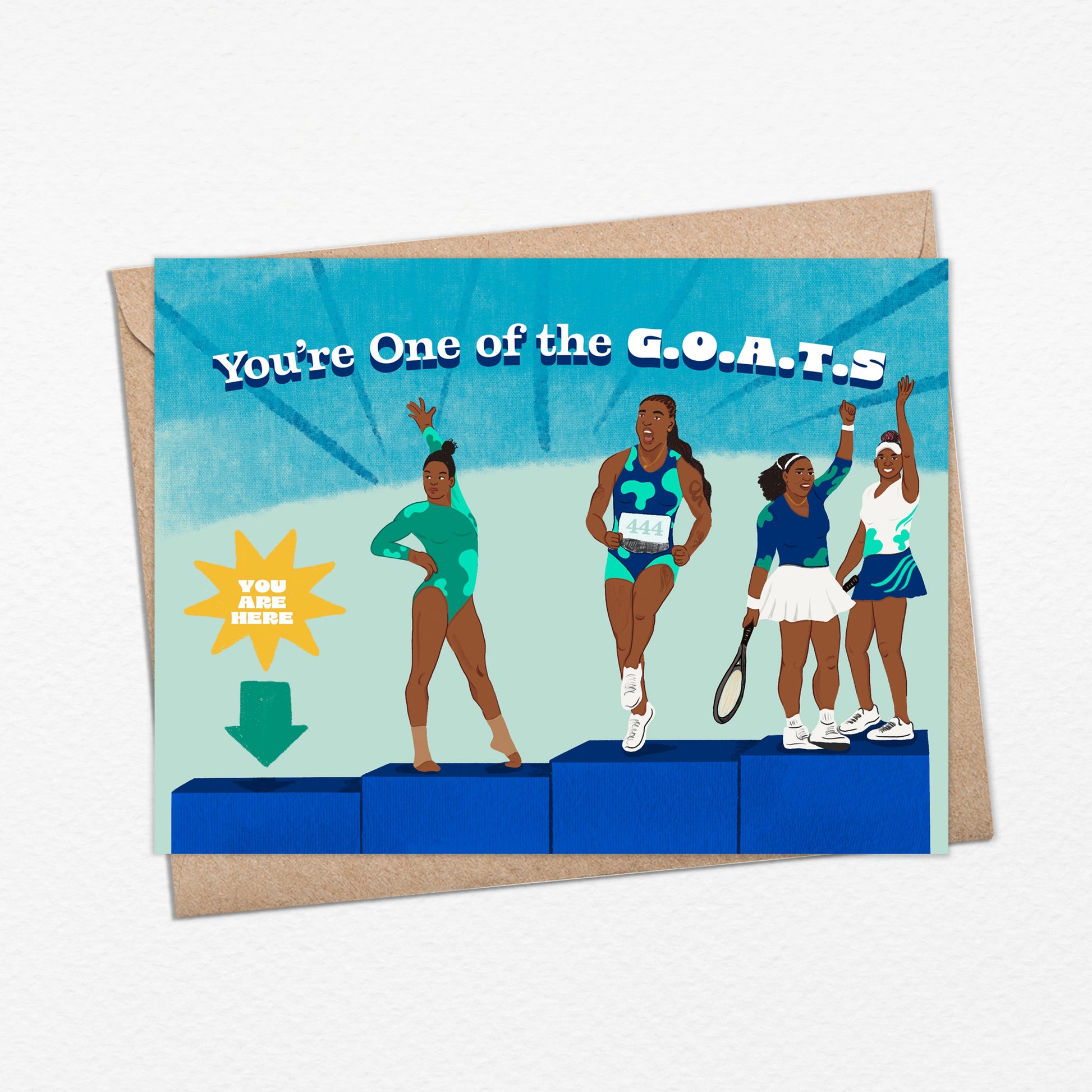 A2 sized card (5.5 x 4.25”) features illustrations of athletes Gabby Douglas, Sha’Carri Richardson, Venus, and Serena Williams on blue podiums. Each wears sports attire, posing uniquely. Text reads 'You’re One of the G.O.A.T.s'. A teal arrow with 'You Are Here' points to an empty podium. Blank inside. Envelope included.