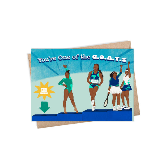 A2 sized card (5.5 x 4.25”) features illustrations of athletes Gabby Douglas, Sha’Carri Richardson, Venus, and Serena Williams on blue podiums. Each wears sports attire, posing uniquely. Text reads 'You’re One of the G.O.A.T.s'. A teal arrow with 'You Are Here' points to an empty podium. Blank inside. Envelope included.