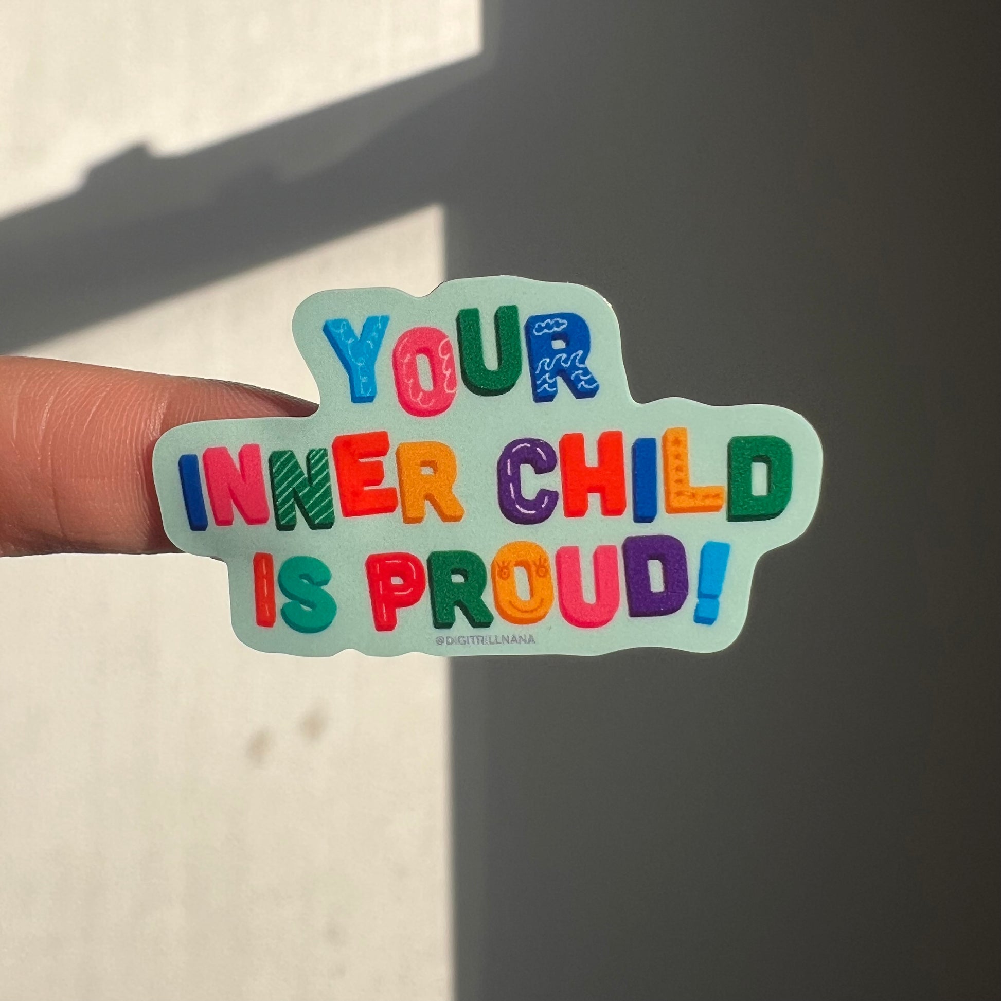 Colorful sticker inspired by rainbow alphabet magnet letters, spelling ‘Your Inner Child is Proud’. This vibrant high-quality kiss cut sticker, adds a touch of joy and nostalgia to any surface. Ideal for laptops, water bottles, phone cases, journals, and more!