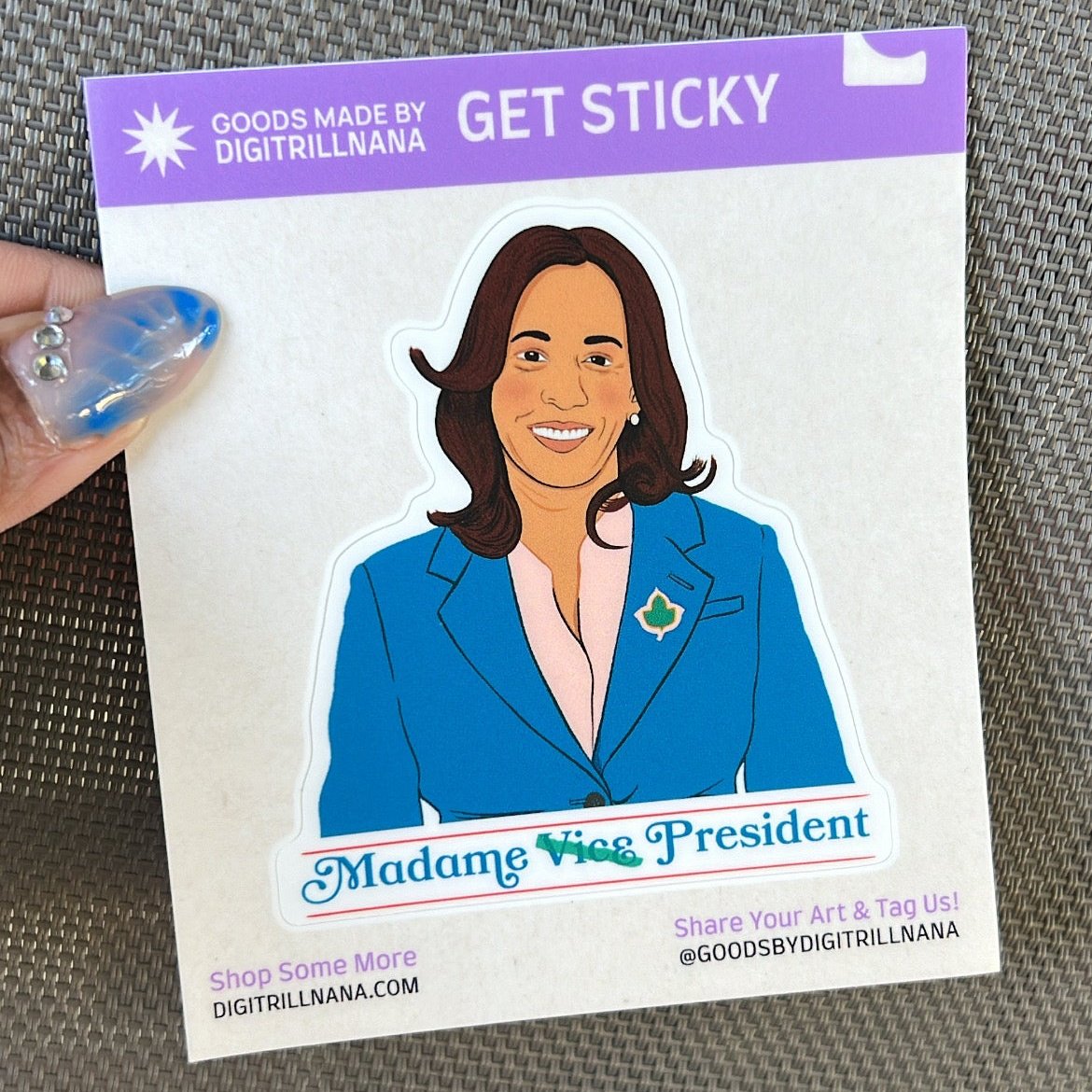 Show your resilient spirit with our Kamala Harris illustration sticker with the words ‘Madame Vice President’ in blue. Perfect for your laptops, water bottles, and more. High-quality vinyl, waterproof stickers.