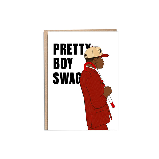 5 by 7 inch greeting card printed on 100% recycled paper for a member of Kappa Alpha Psi Fraternity. The card includes an illustration of a African American young man, college student, in a red pinstripe suite with a Kappa Nupe cane over his shoulder, wearing a vintage snapback Kappa baseball cap. The sans serif text is black, sits behind the illustration to the left, reads "Pretty Boy Swagg". The inside of the card is blank. Envelope included with order.