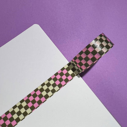 15mm checkered washi tape roll with a bold pink and green geometric pattern. Re-adjustable and removable. Perfect for your planner, junk journal, and scrapbook.