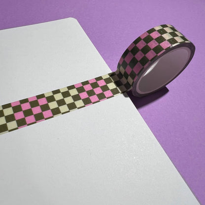 15mm checkered washi tape roll with a bold pink and green geometric pattern. Re-adjustable and removable. Perfect for your planner, junk journal, and scrapbook.