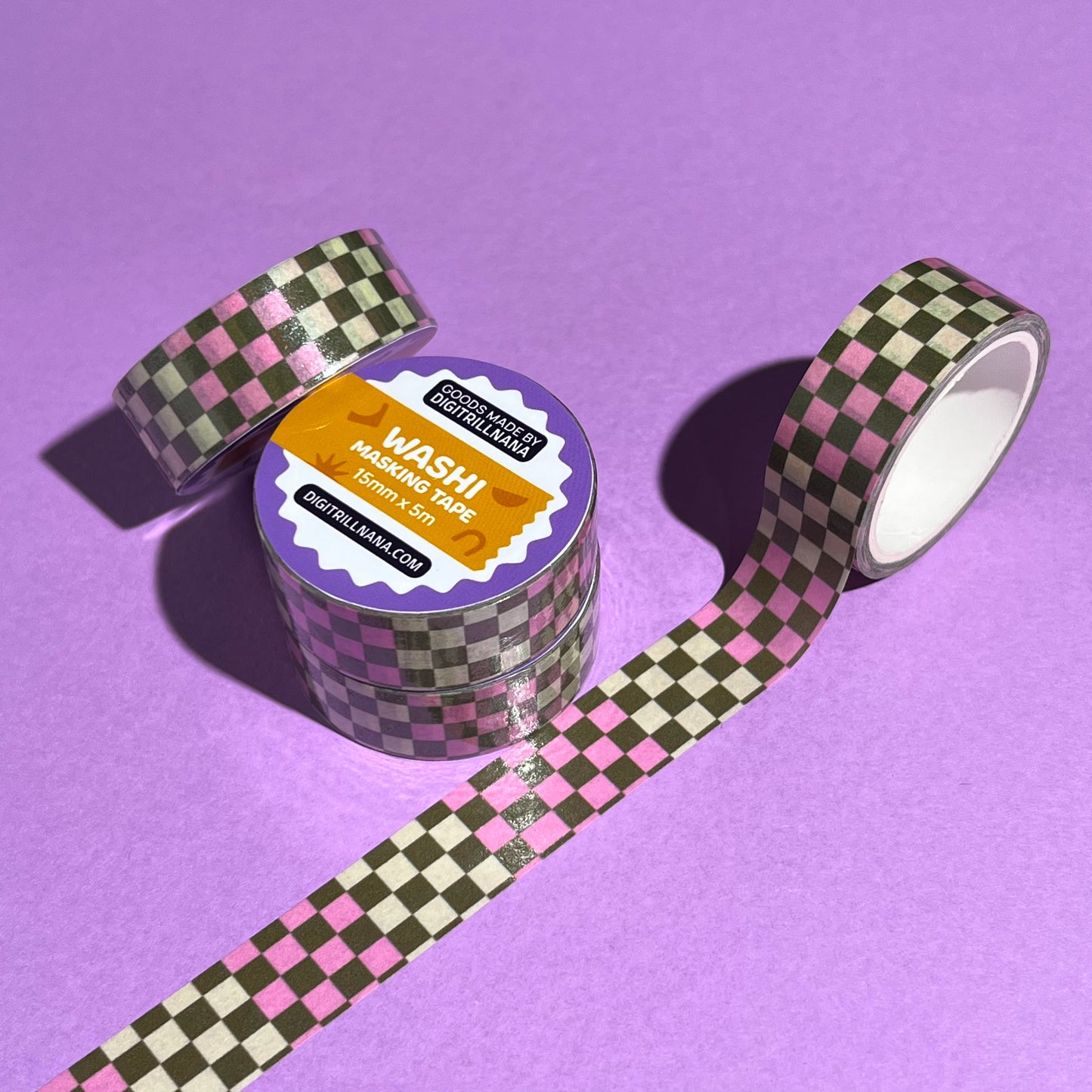 15mm checkered washi tape roll with a bold pink and green geometric pattern. Re-adjustable and removable. Perfect for your planner, junk journal, and scrapbook.