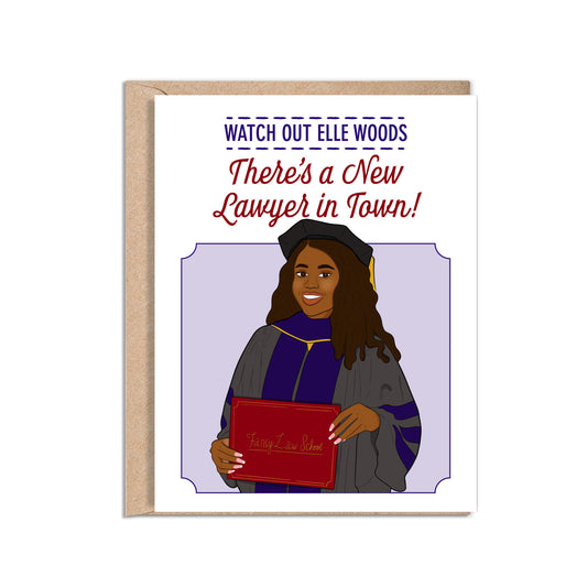 4.25 x 5.5” A2 size vibrant card illustration featuring an African American female law student with graduation regalia holding a red certificate. The text, "Watch Out Elle Woods There's a New Lawyer in Town!" is in purple and red. Envelope included. Black Woman Owned.