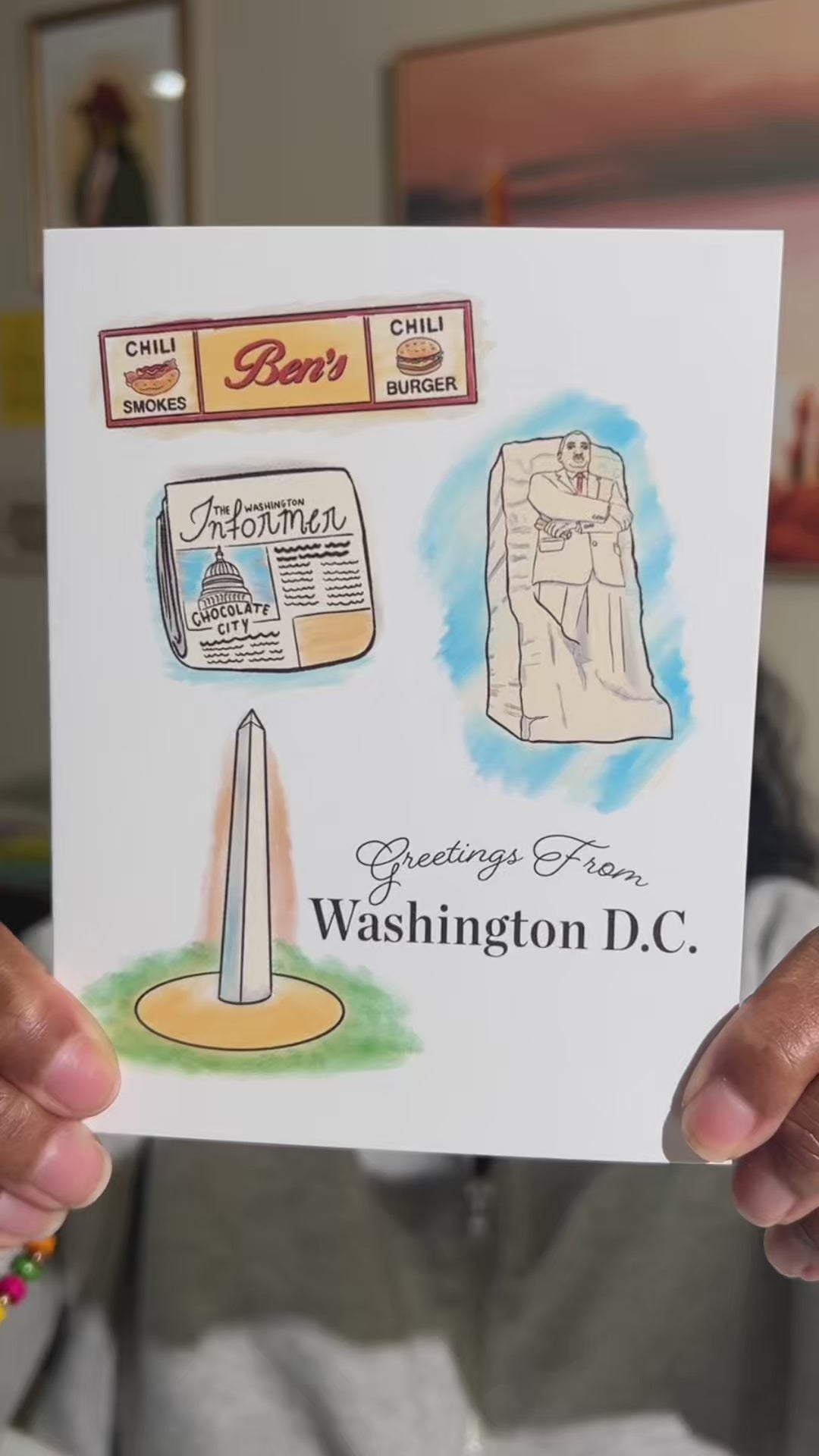 A2 size colorful card featuring illustrations of the Washington Monument, Ben’s Chili Bowl Sign, Washington Informer magazine, and Martin Luther King Memorial Statue. “Greetings from Washington DC” text on the front. Blank inside. Envelope included.